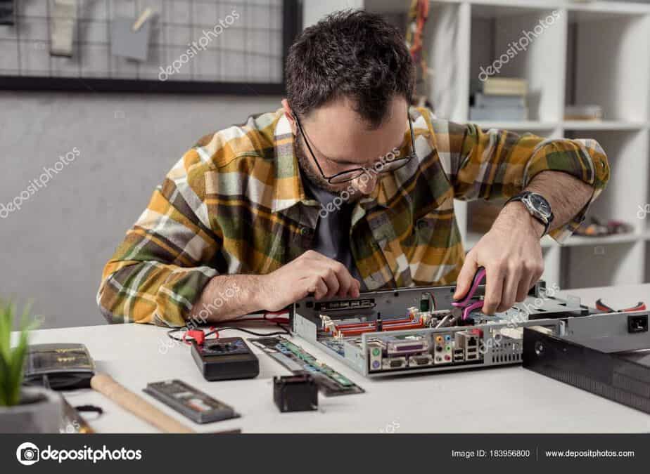 depositphotos_183956800-stock-photo-repairman-using-tongs-while-fixing